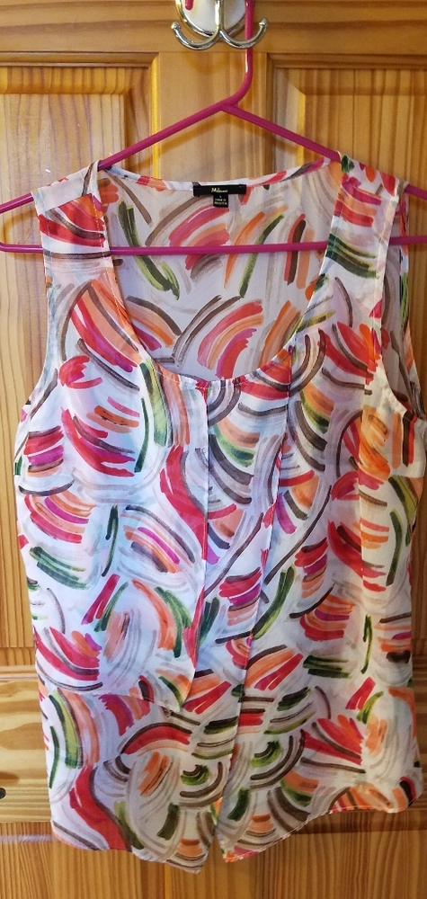 Sheer Milano sleeveless blouse.